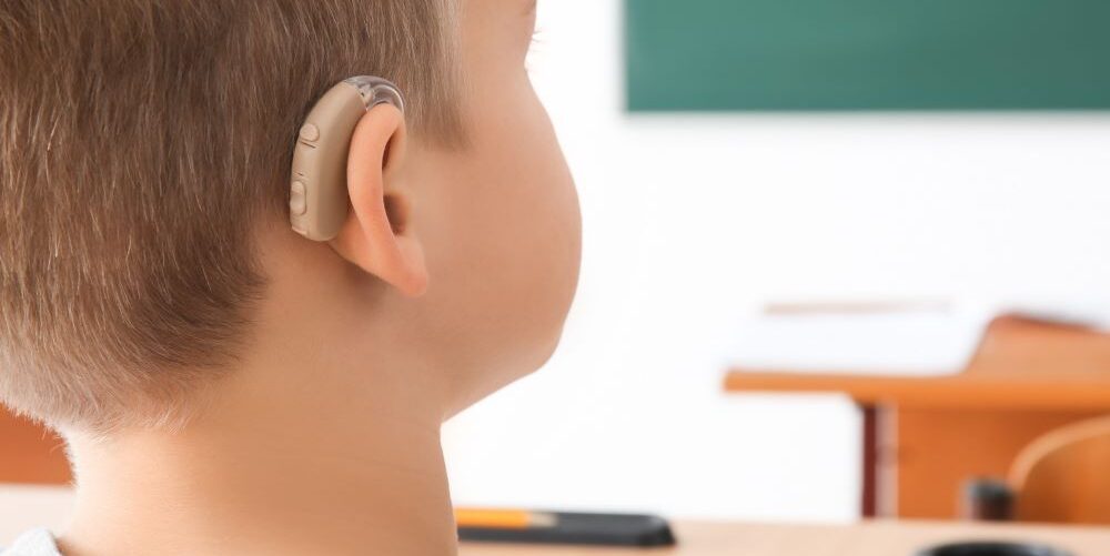 Boy wearing hearing aid